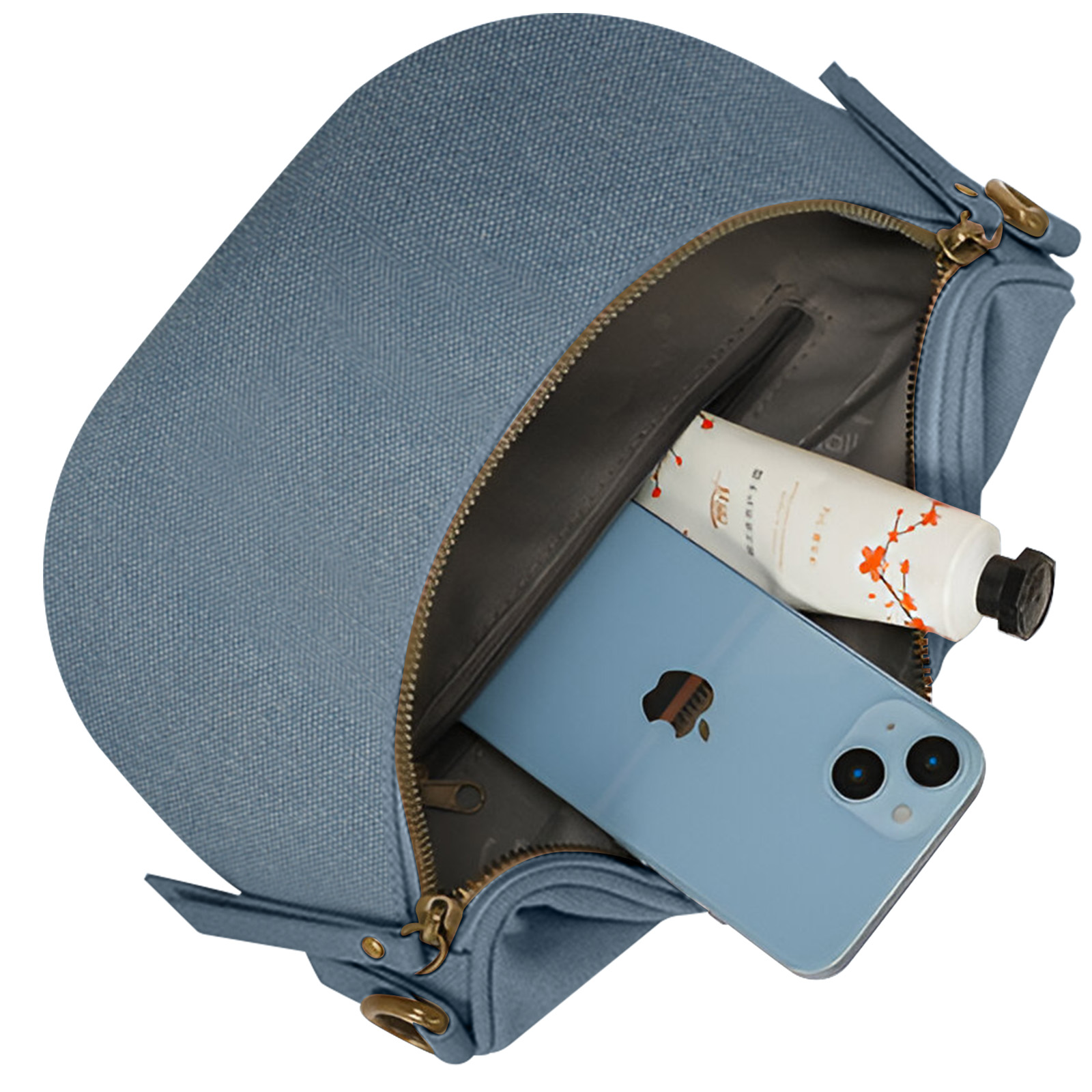 Una bolsa azul claro está abierta, con un teléfono azul claro y un tubo de crema blanco en su interior.