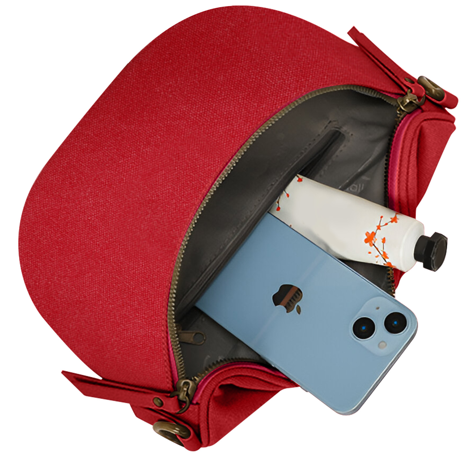 Una bolsa roja con un teléfono y loción dentro. La bolsa está abierta para mostrar el contenido.