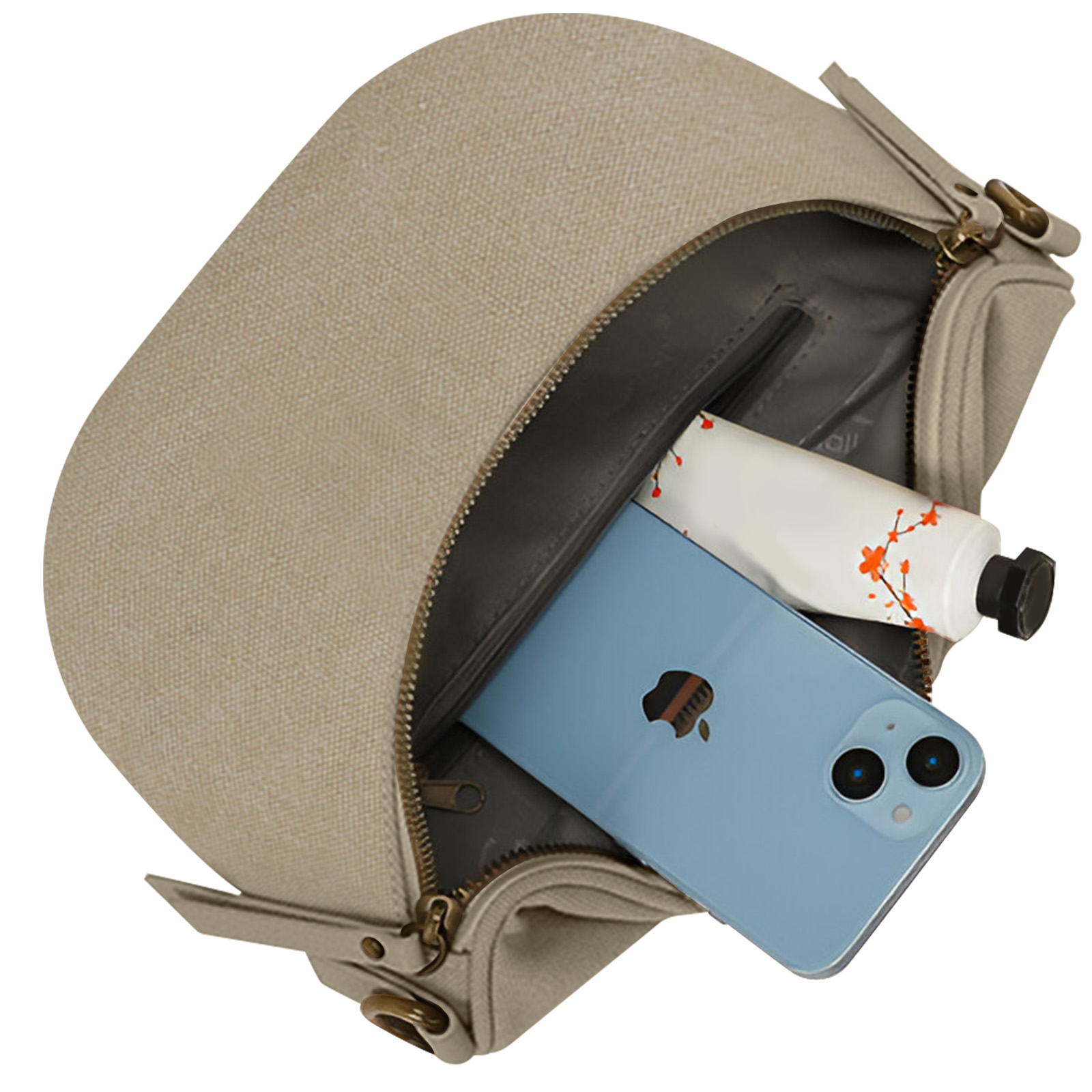 Una bolsa beige con un teléfono azul y un tubo de crema dentro. Cremallera y correas visibles.