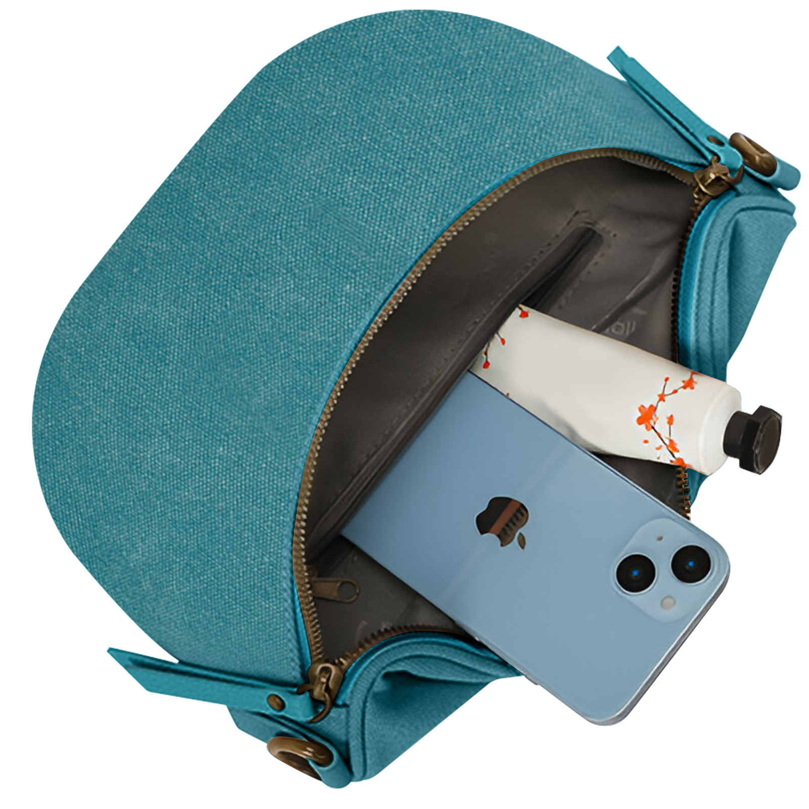 Türkisfarbene Tasche geöffnet, zeigt Telefon und Farbtube. Die Tasche ist türkisfarben.