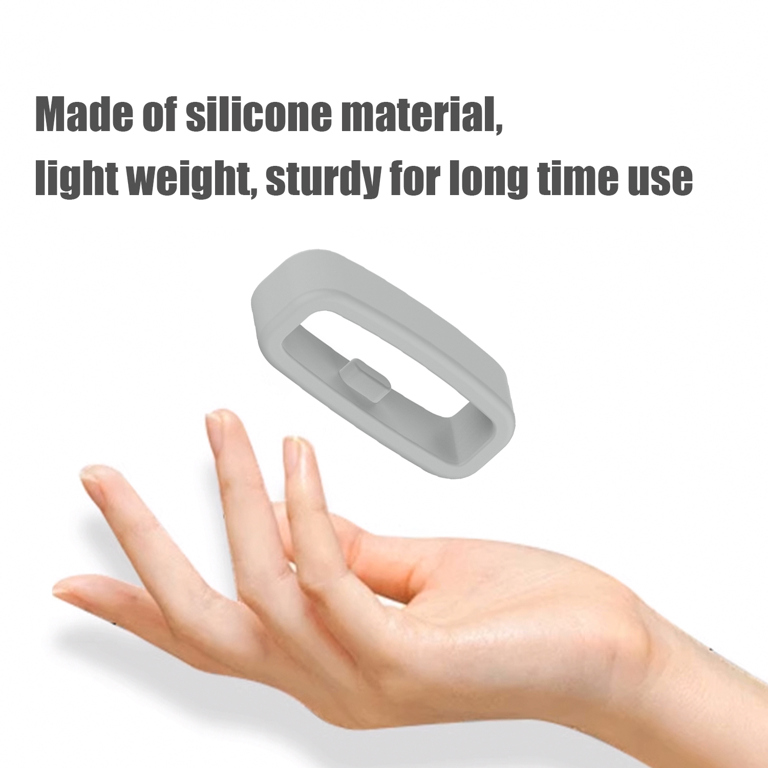 Ein graues Silikonband, das von einer Hand gehalten wird, Text: aus Silikonmaterial.