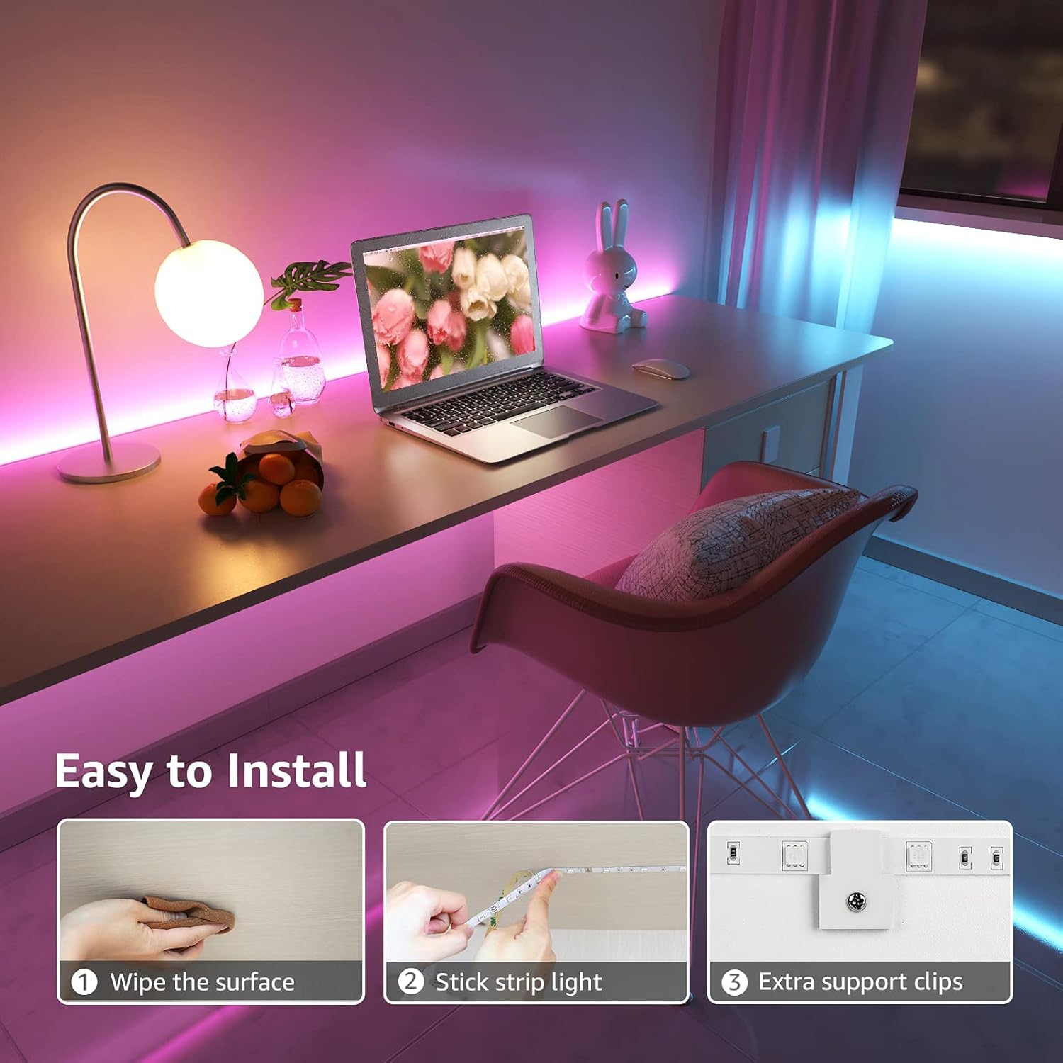 Ein Schreibtisch mit Laptop, Lampe und Dekorationen. Die Wand hat LED-Streifen.