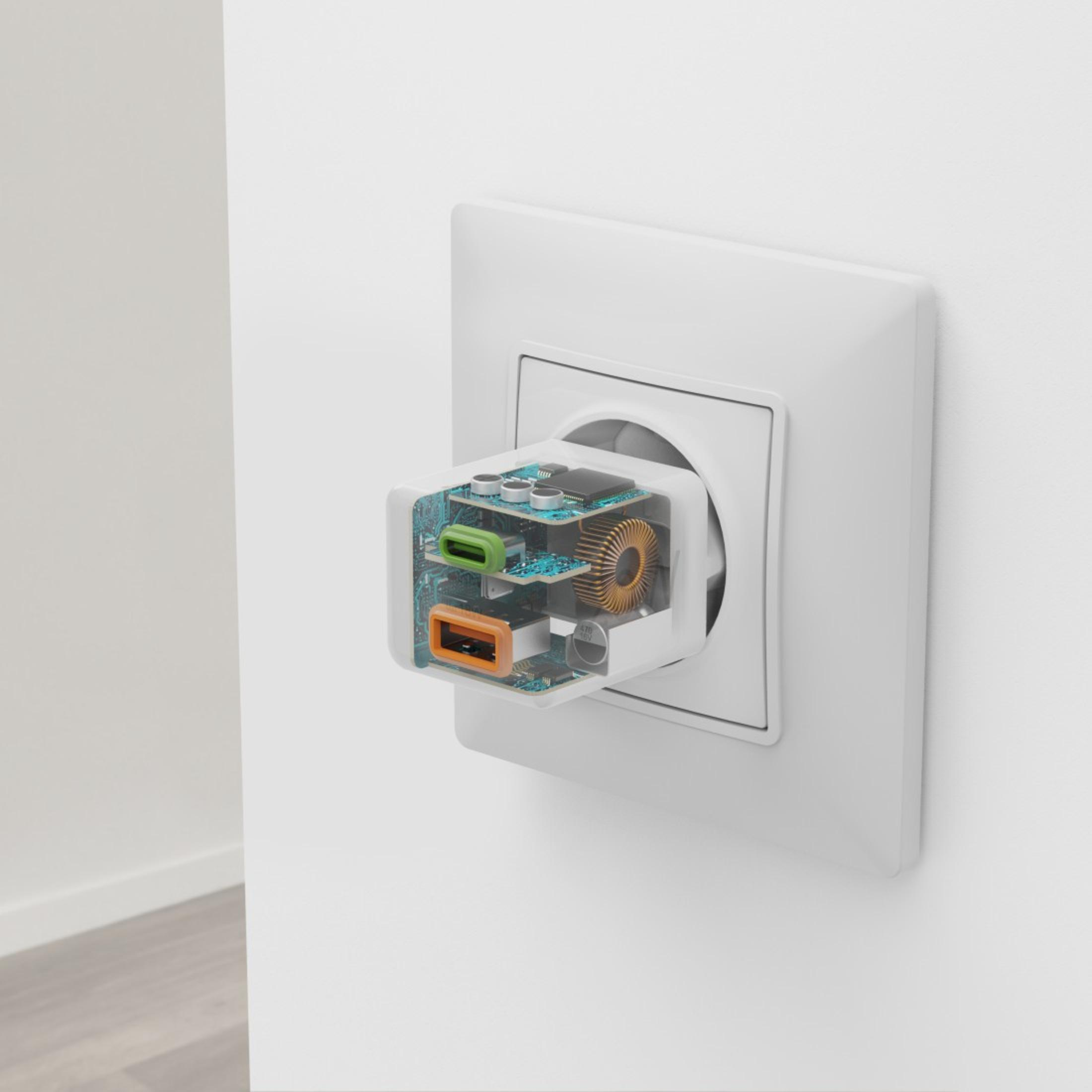 A wall socket with a transparent charger plugged in, showing internal components.