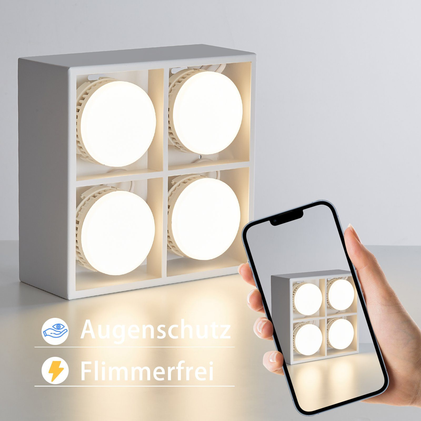 Biała oprawa oświetleniowa z czterema podświetlonymi sekcjami. Telefon wyświetla podobny widok.