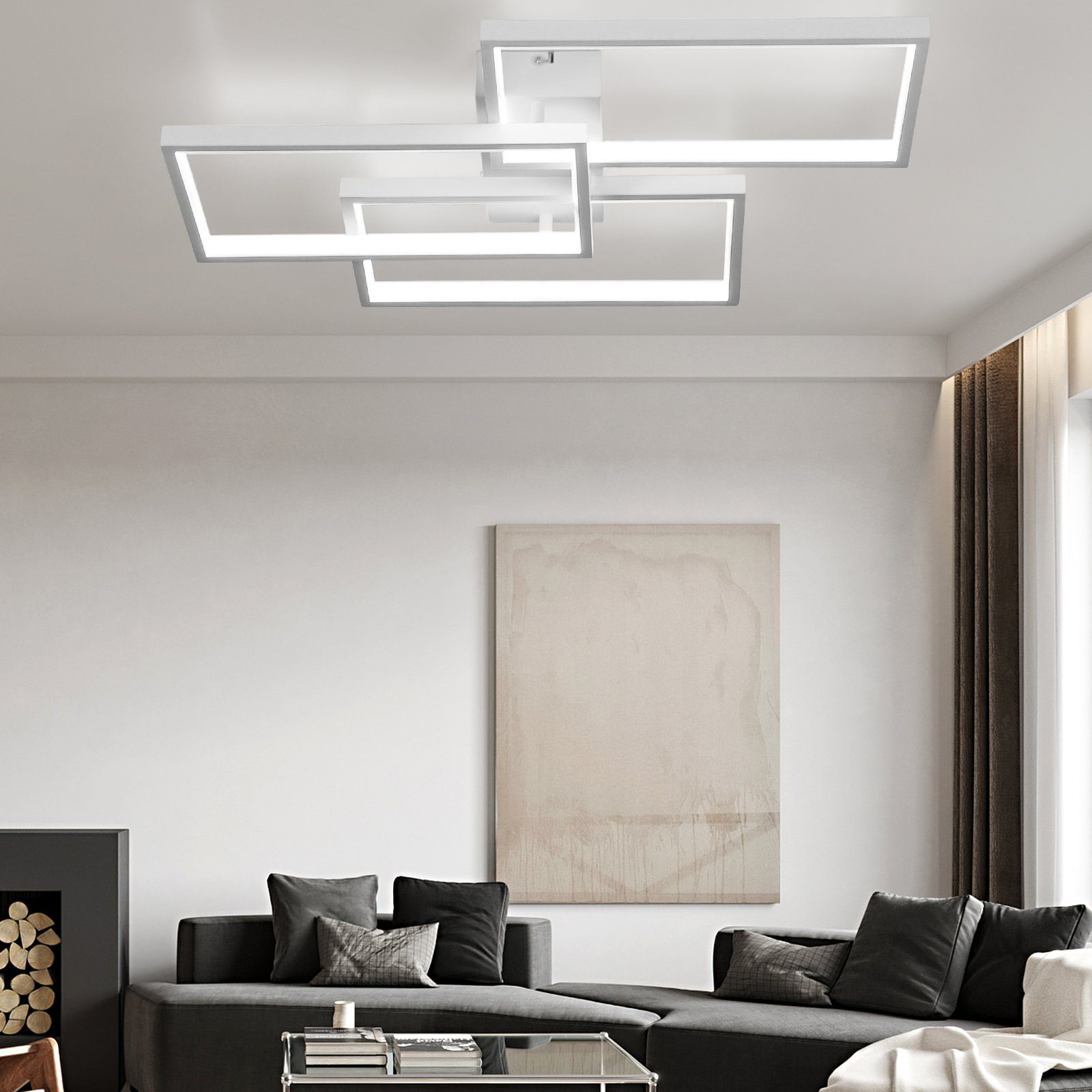 Nowoczesny salon z prostokątnymi lampami sufitowymi i szarą sofą.