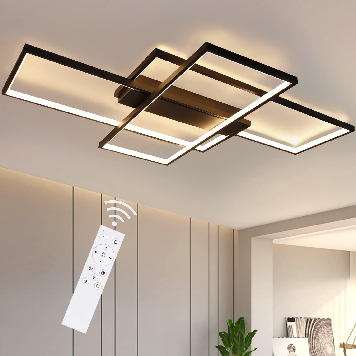 Lampada da soffitto moderna con forme rettangolari. Un telecomando è in primo piano.