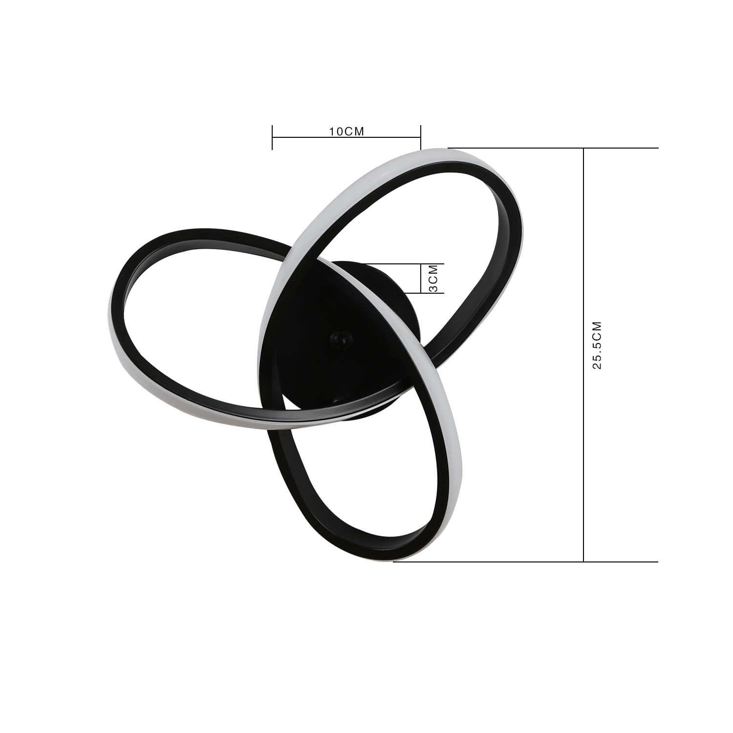 Czarno-biała abstrakcyjna oprawa LED. Oprawa ma konstrukcję z trzema pętlami, zamontowaną na białej ścianie.