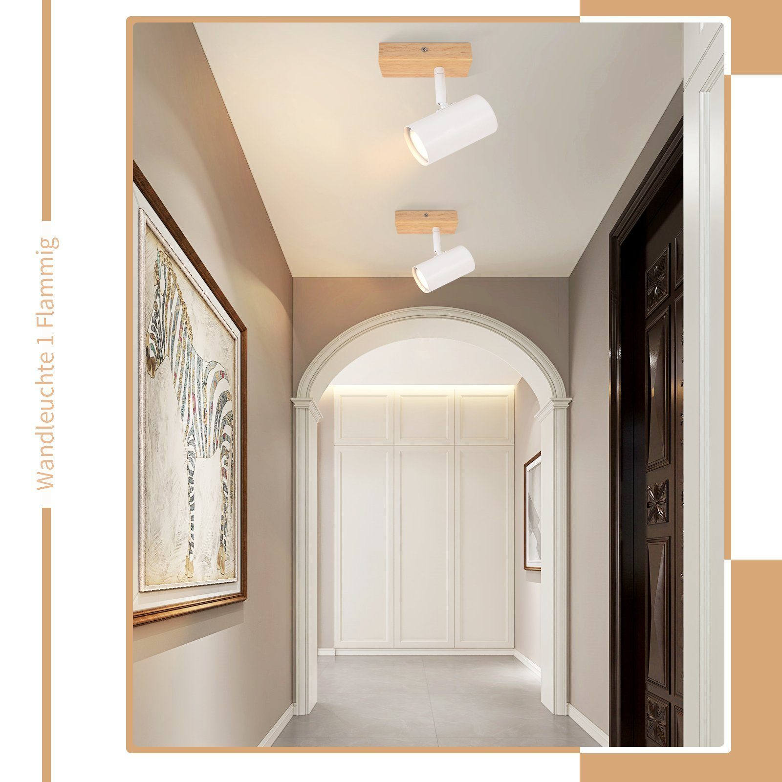Korytarz z oświetleniem wpuszczanym, obrazem, białymi drzwiami i reflektorami sufitowymi.