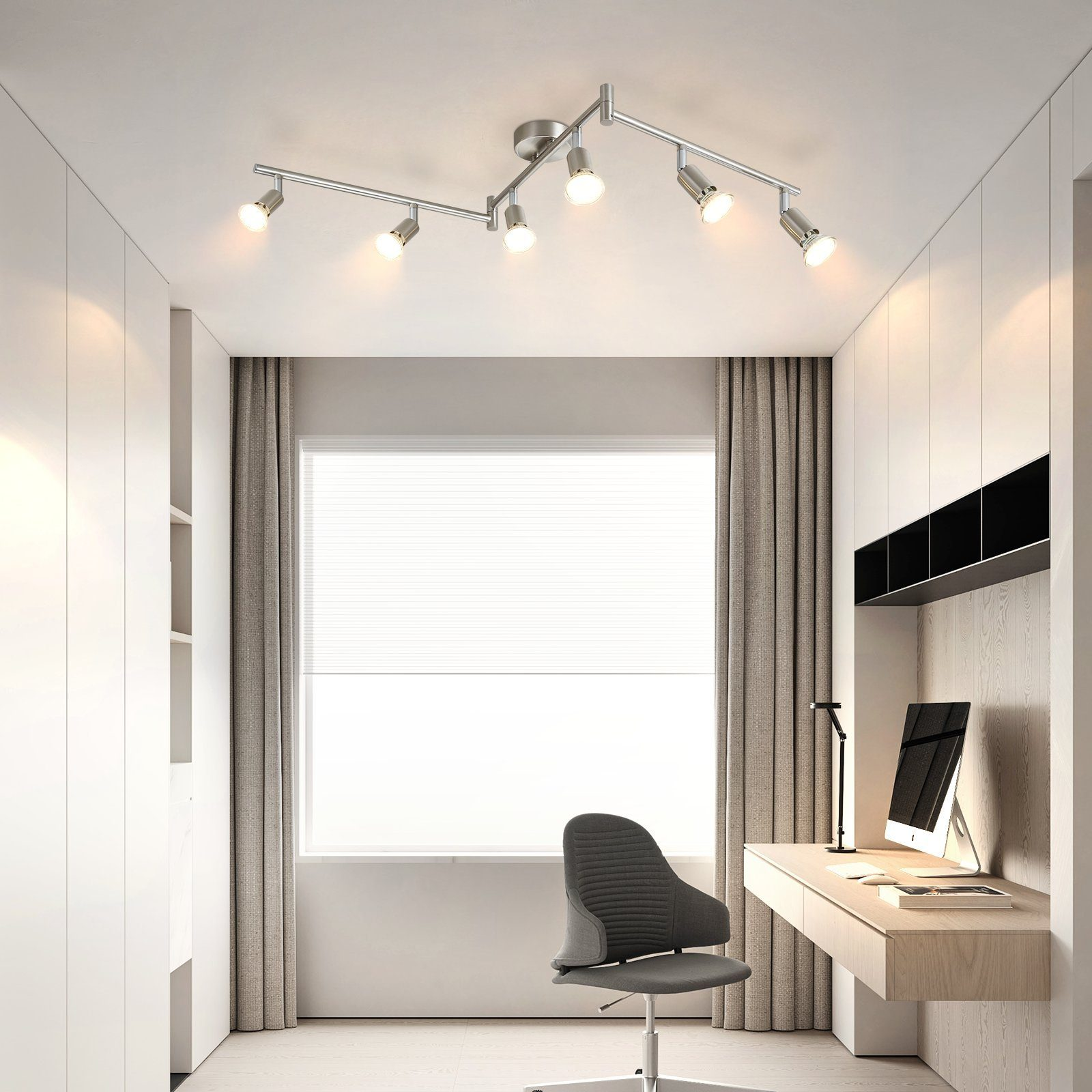 Nowoczesne biuro z oświetleniem szynowym, biurkiem, krzesłem, oknem i zasłonami.