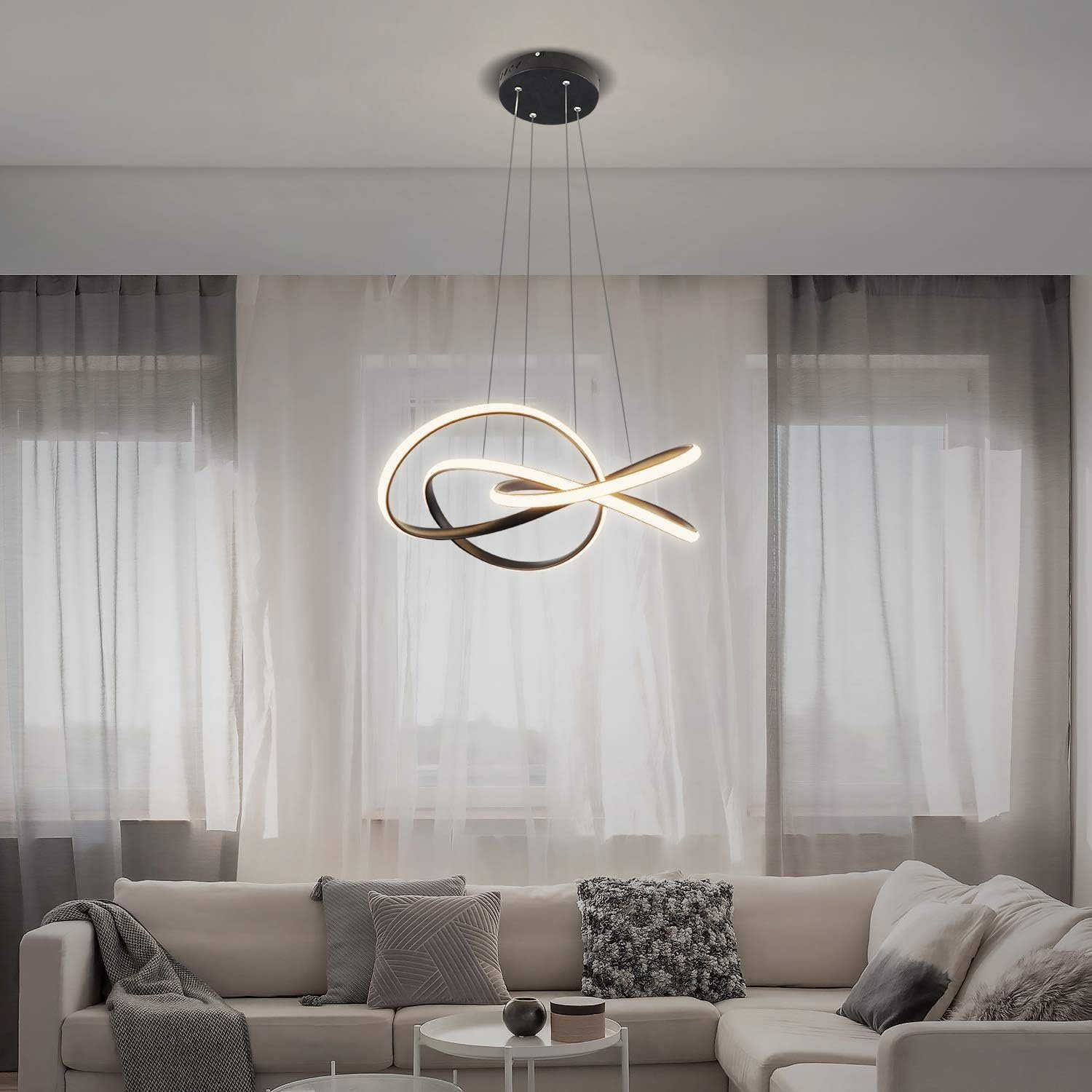 Nowoczesna lampa wisząca z pętelkowym wzorem, wisząca u sufitu w salonie.