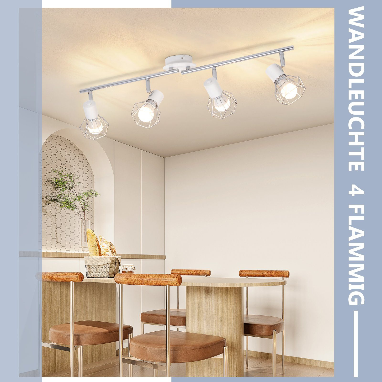 Cztery reflektory na szynie, nad stołem jadalnym. Ściana ma dekoracyjny łuk.