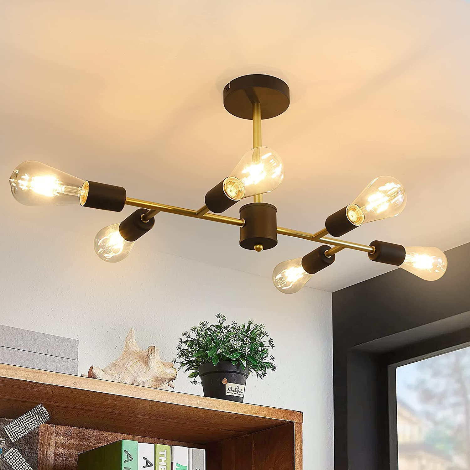 Nowoczesny żyrandol z sześcioma żarówkami, z półką i roślinami w tle.