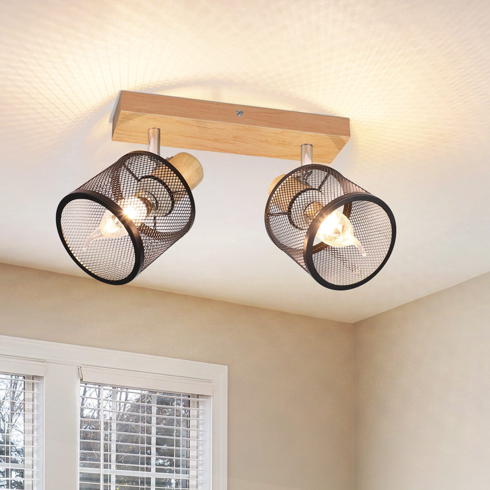 Oprawa sufitowa z dwiema czarnymi lampami stożkowymi z siatki.