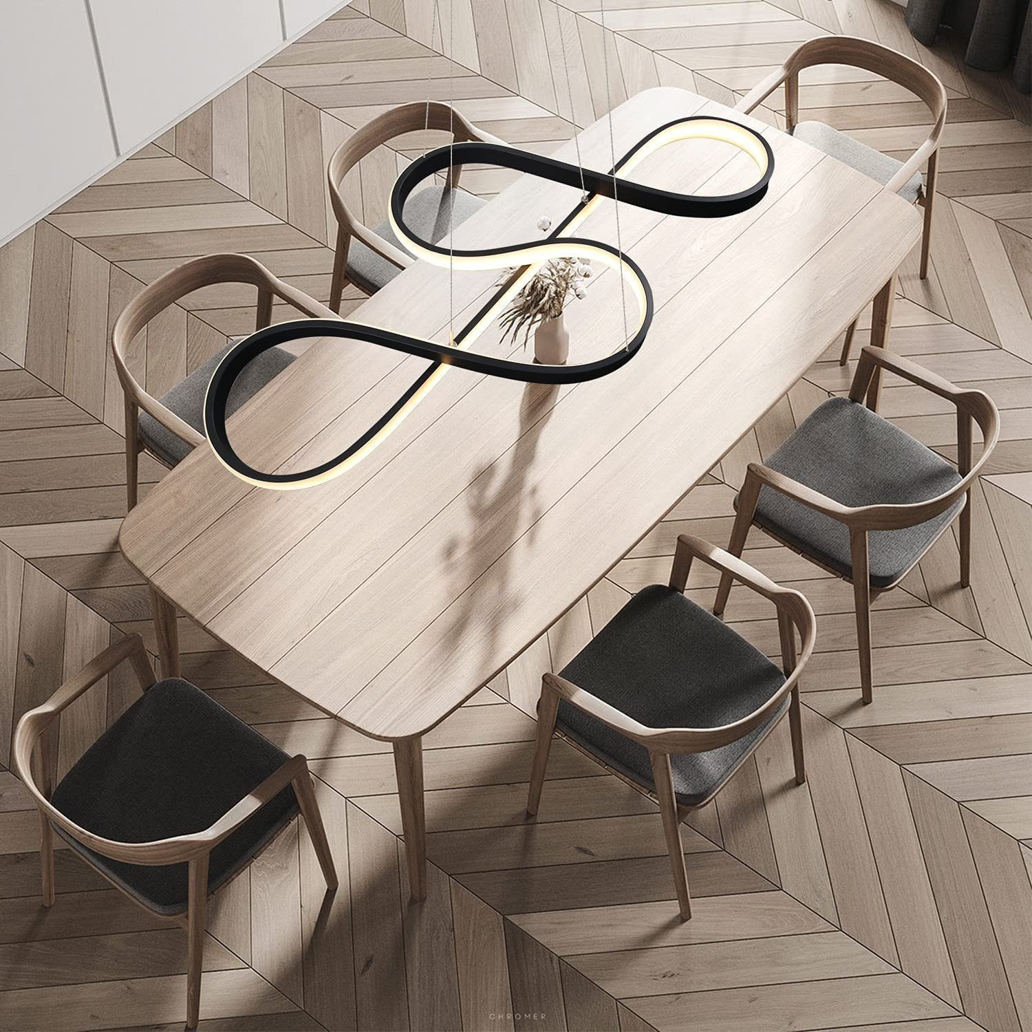 Sala da pranzo: Tavolo in legno con sedie, lampada a forma di infinito. Pavimento in legno, toni neutri.