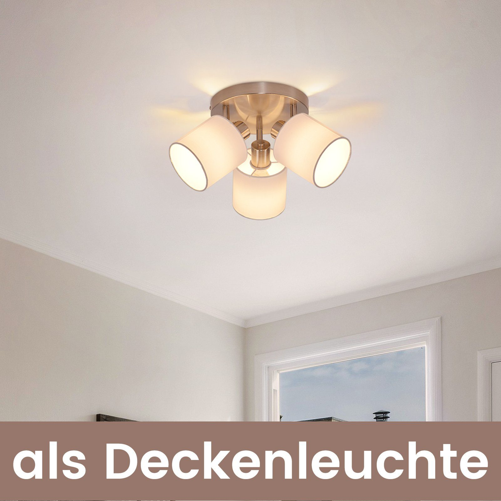 Oprawa oświetleniowa sufitowa z trzema światłami, na tle beżowej ściany i białego sufitu.