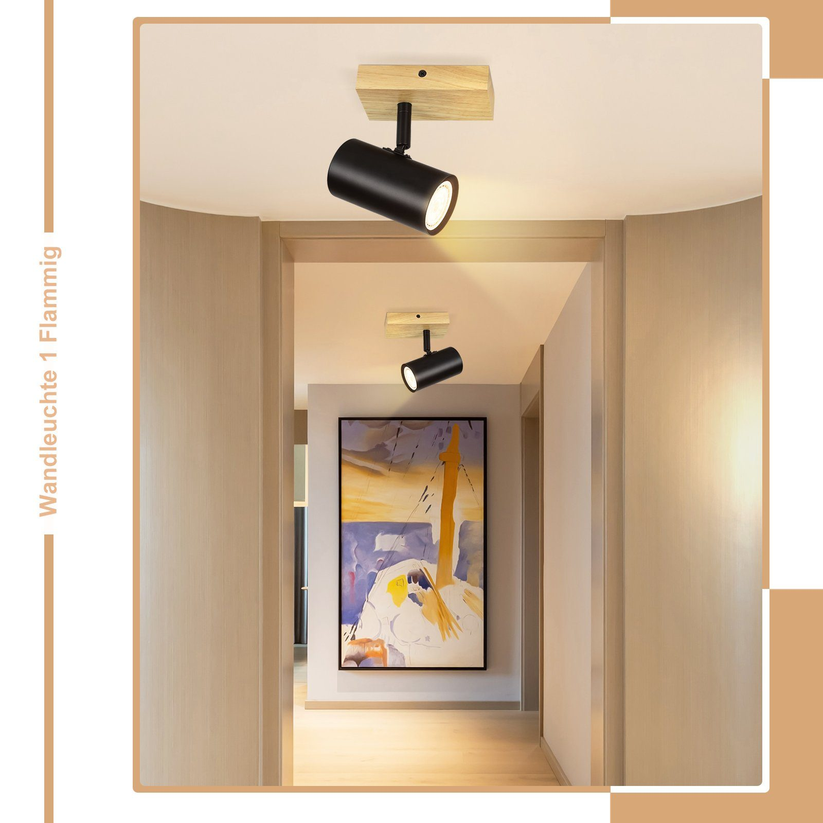 Due faretti neri montati a soffitto, che illuminano un corridoio con opere d'arte.