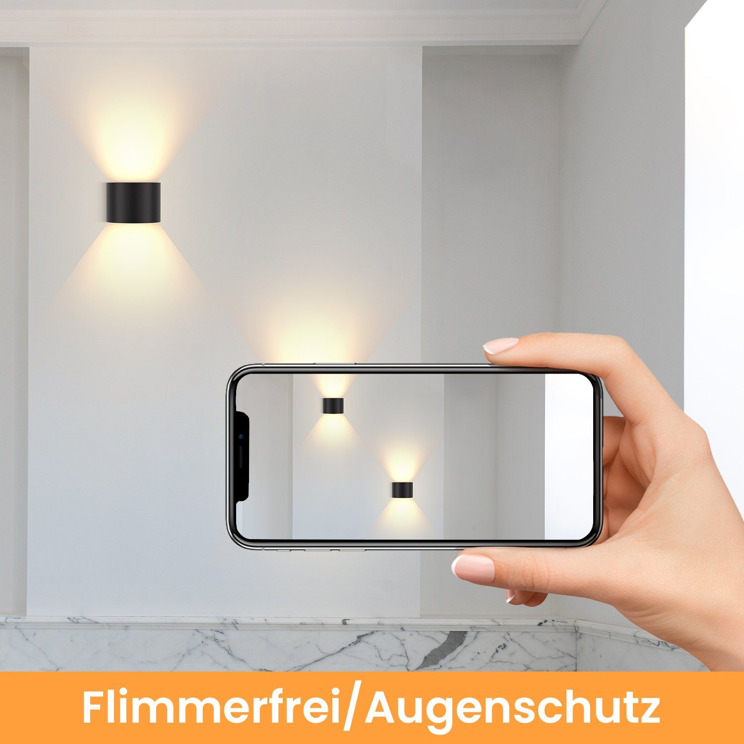 Mano che tiene un telefono che mostra le luci a parete. Le luci sono nere ed emettono calore.