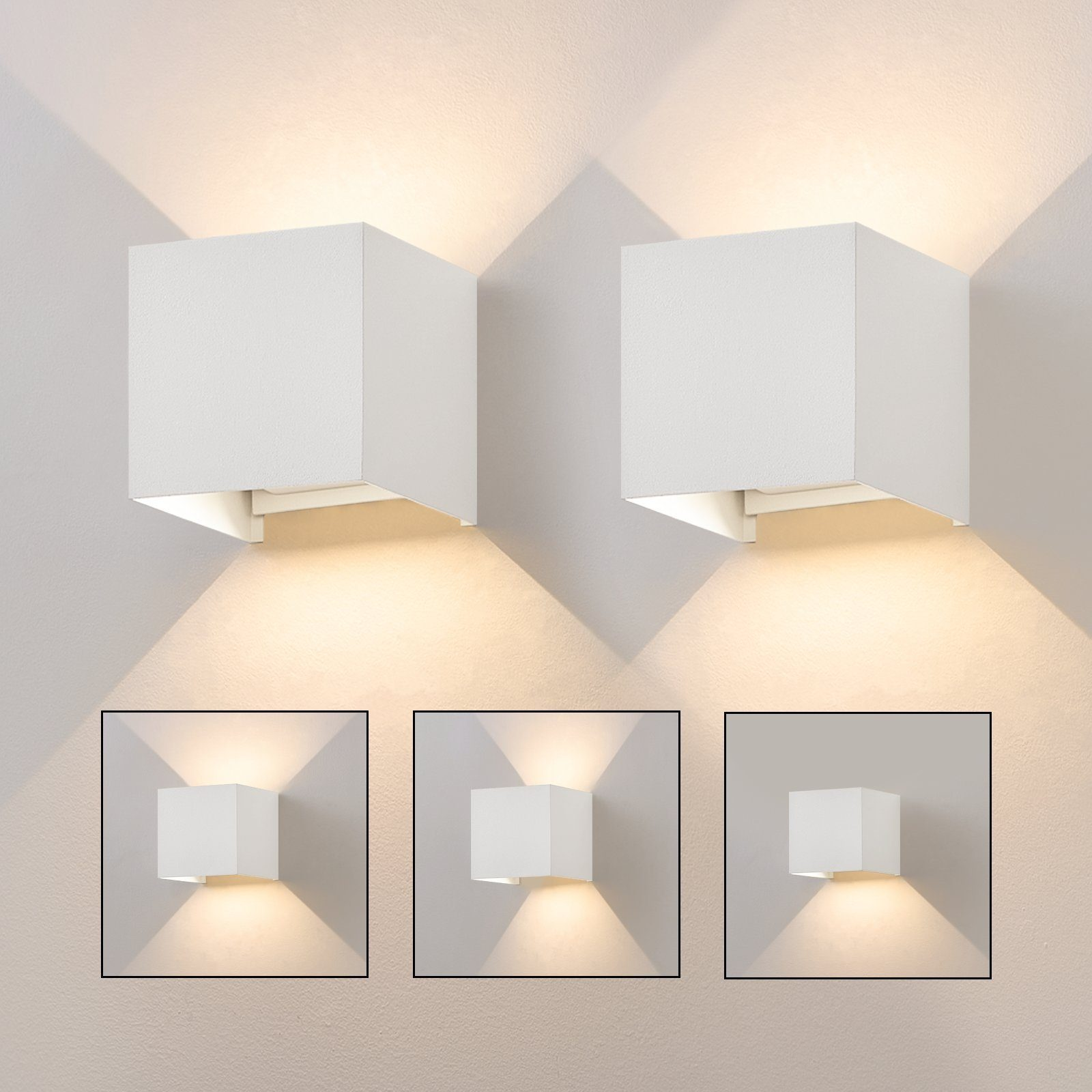 Due lampade da parete quadrate bianche che emettono luce, con più viste della luce.