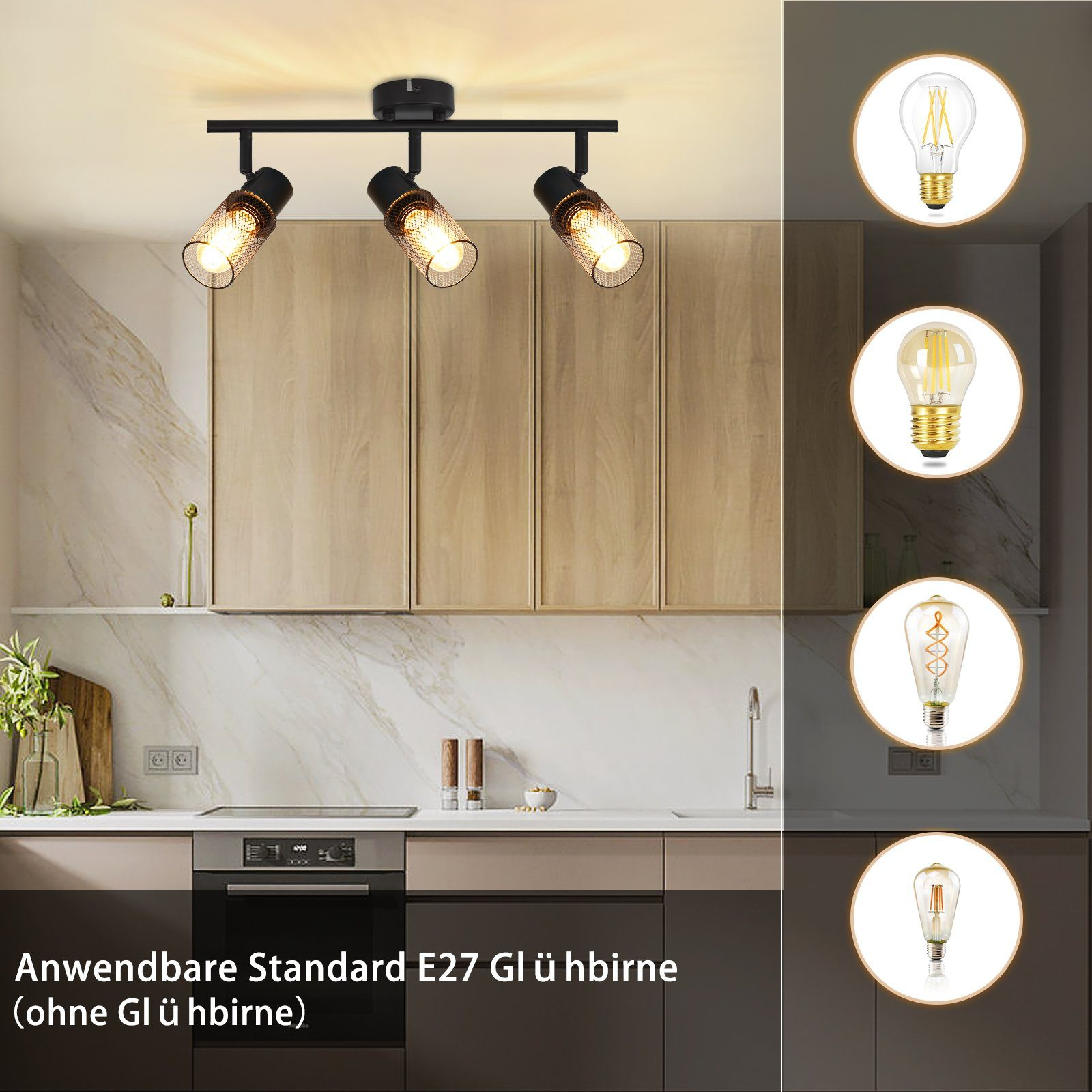 Una cucina con illuminazione a binario che mostra diversi tipi di lampadine. La cucina ha un paraschizzi in marmo.