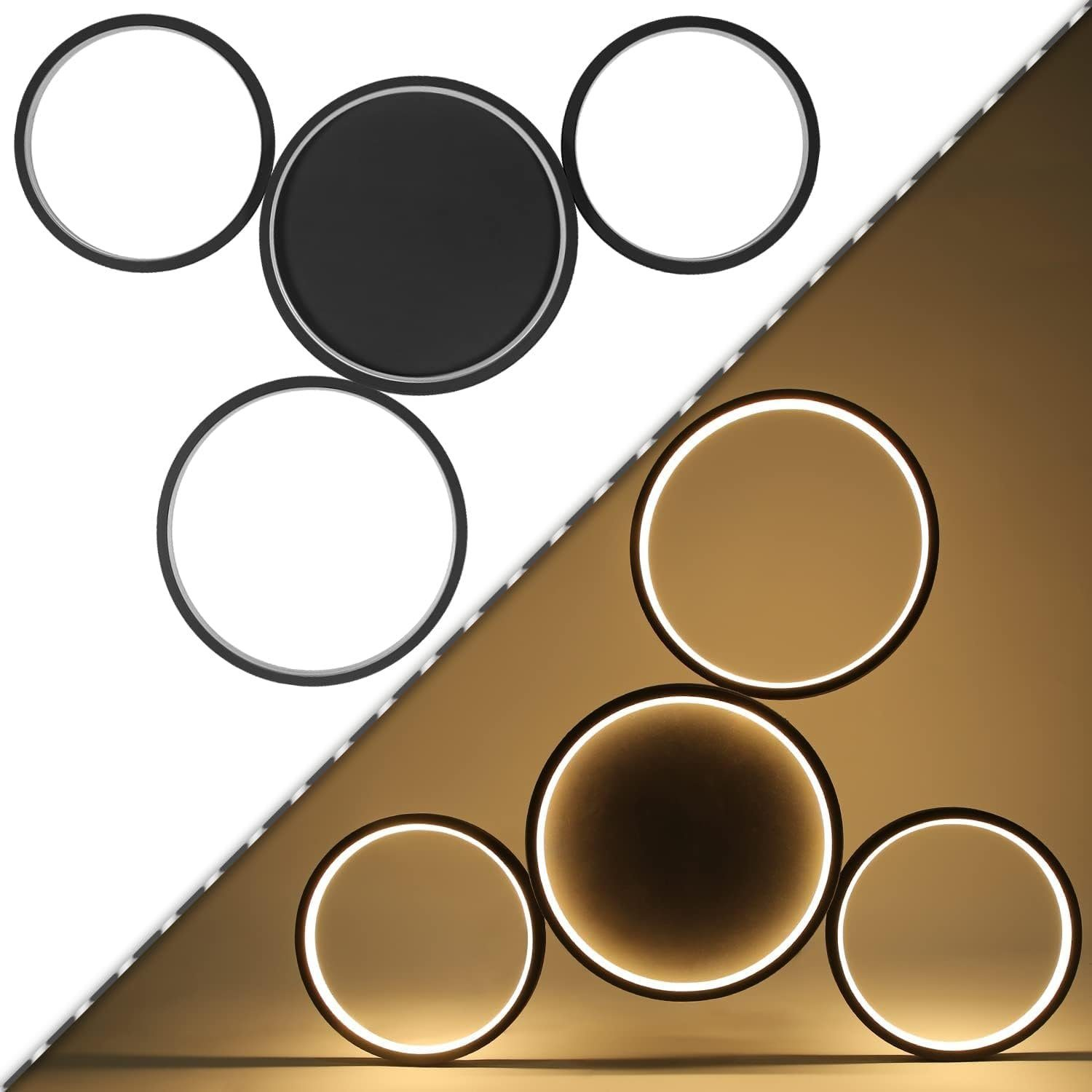 L'immagine mostra due viste di un apparecchio di illuminazione circolare. Un lato è nero, l'altro bianco. La luce è in basso.