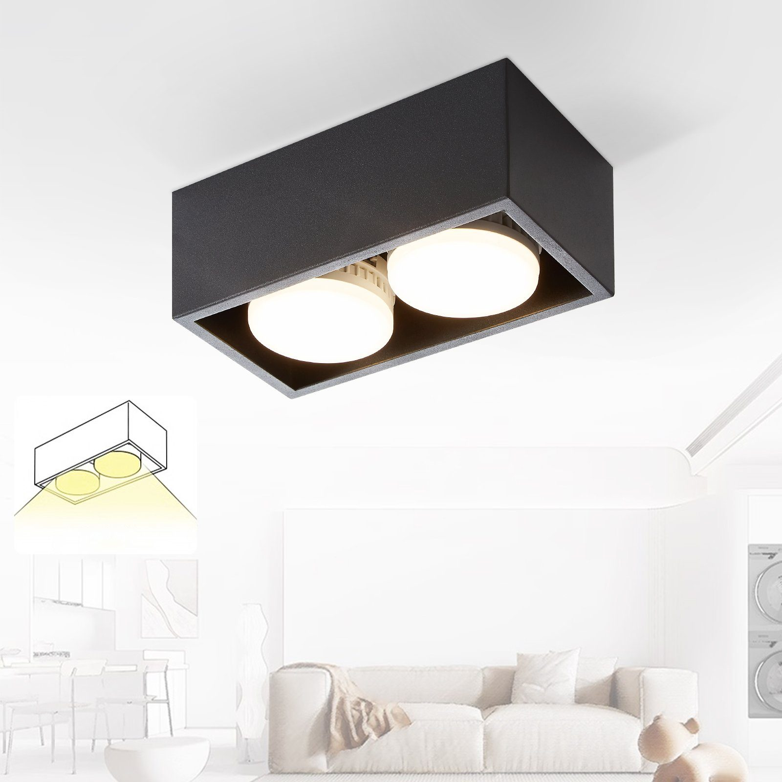 Lampada da soffitto rettangolare nera con due luci rotonde che emettono luce, in una stanza bianca.