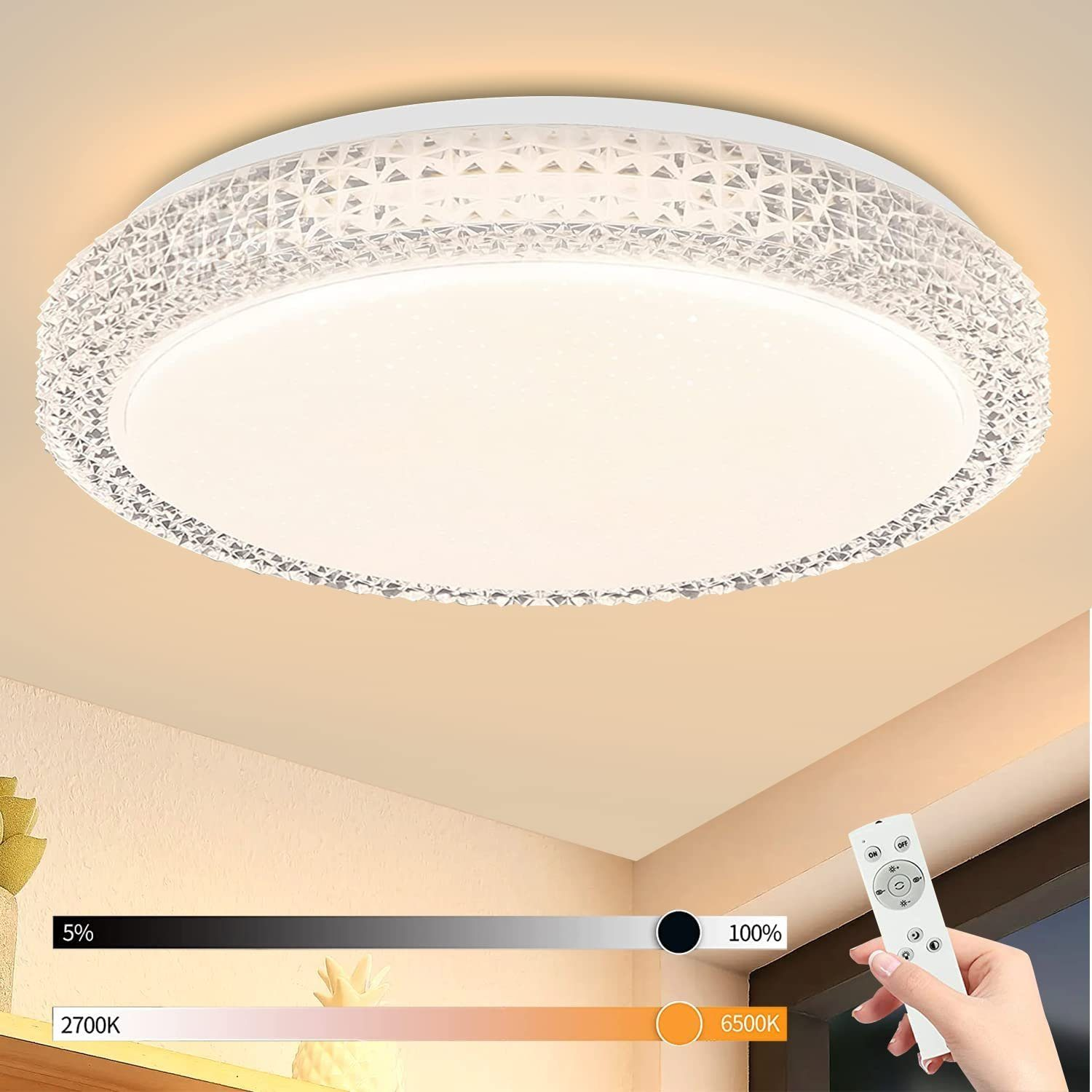 Plafoniera rotonda con dettagli in cristallo e un telecomando che mostra i livelli di luminosità.