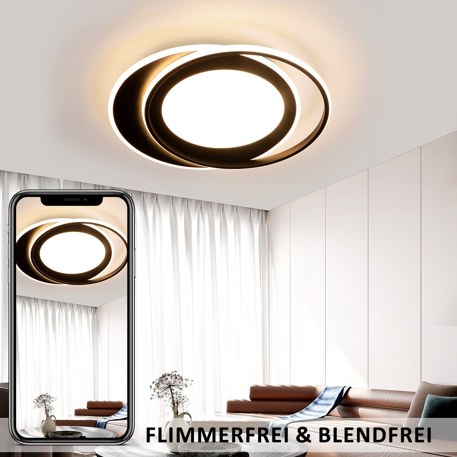 Lampada da soffitto con anelli bianchi e neri. Telefono con luce sullo schermo, stanza sullo sfondo.