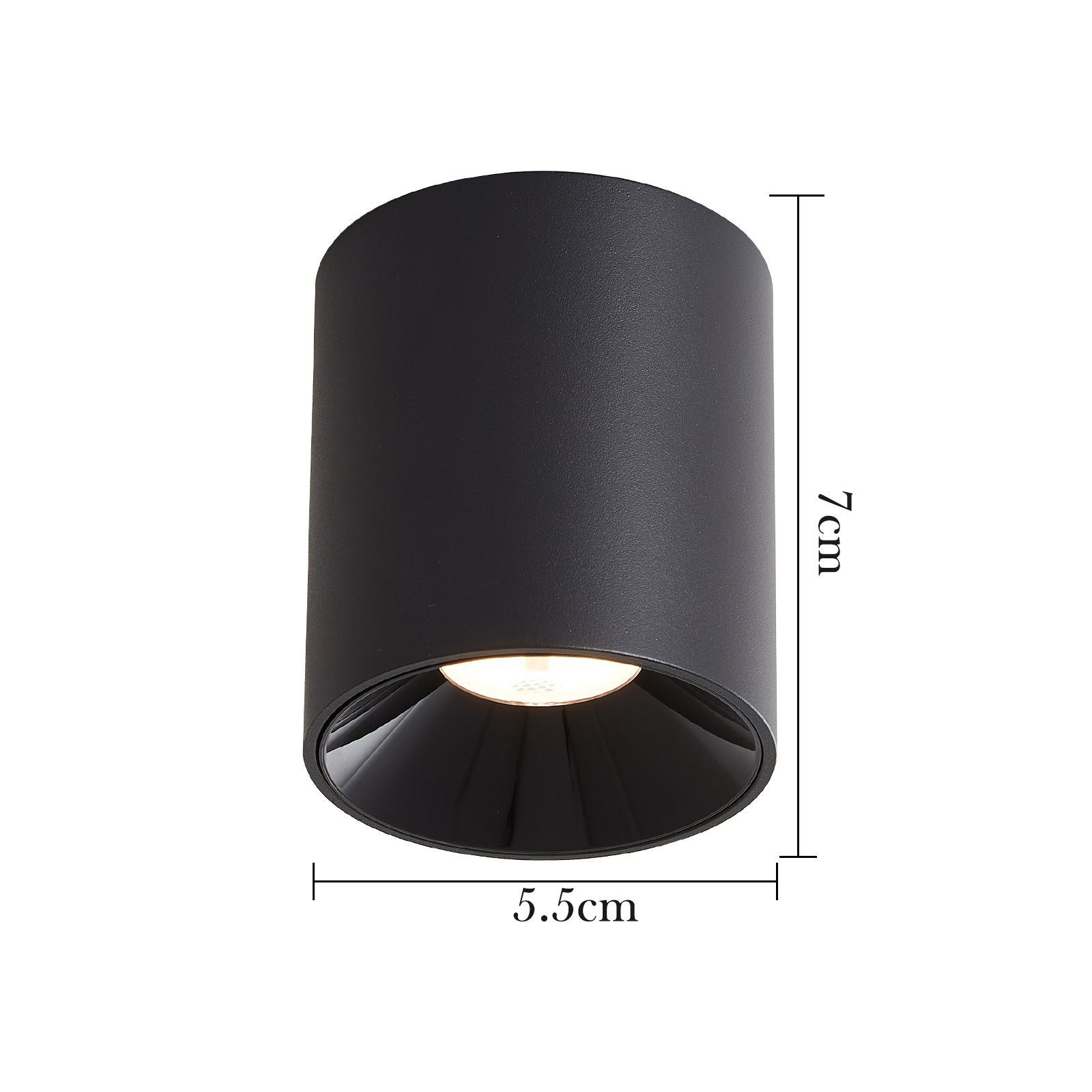 Un apparecchio di illuminazione a cilindro nero. Le dimensioni sono 7 cm di altezza e 5,5 cm di diametro.
