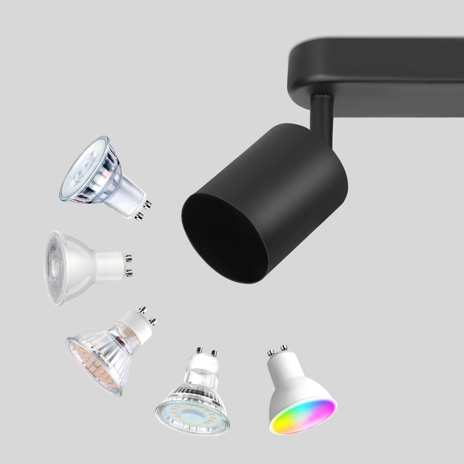 Un faretto nero con diverse lampadine, tra cui una con LED che cambiano colore.
