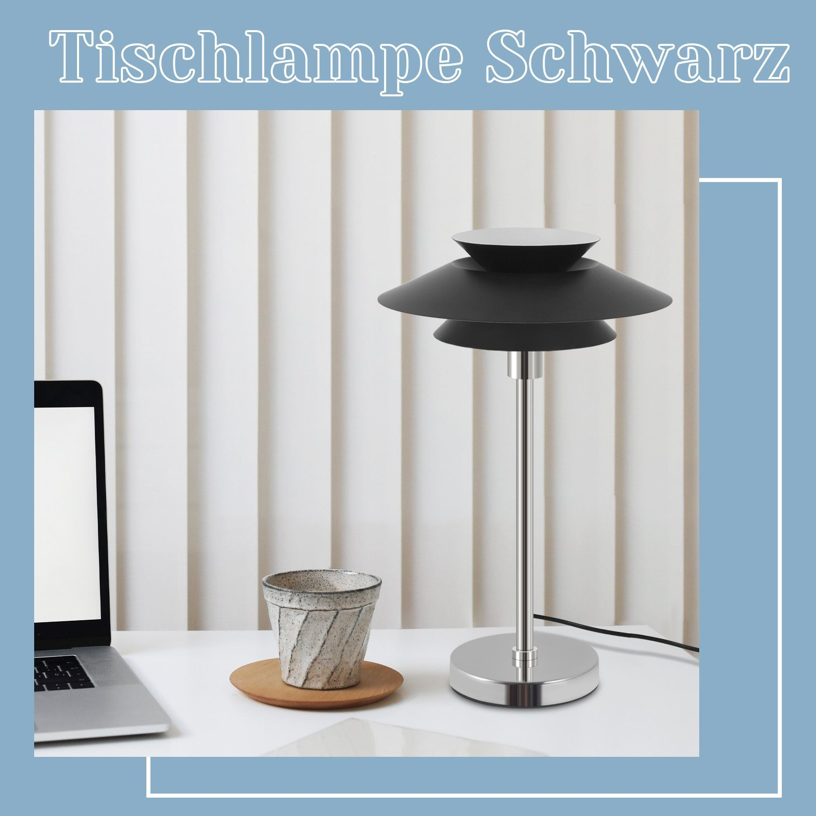 Czarna lampa stołowa z warstwowym kloszem i srebrną podstawą, na białym biurku.