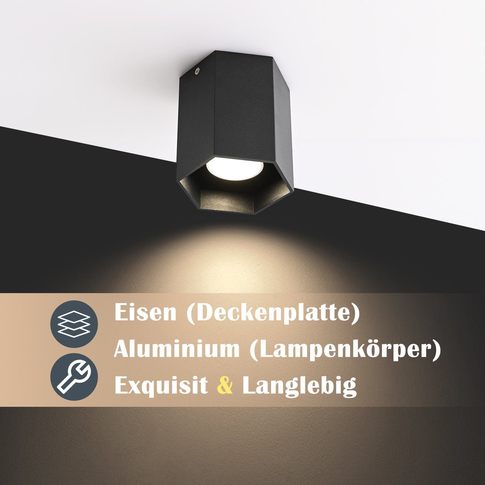 Una plafoniera nera a forma esagonale. È montata su un soffitto bianco.