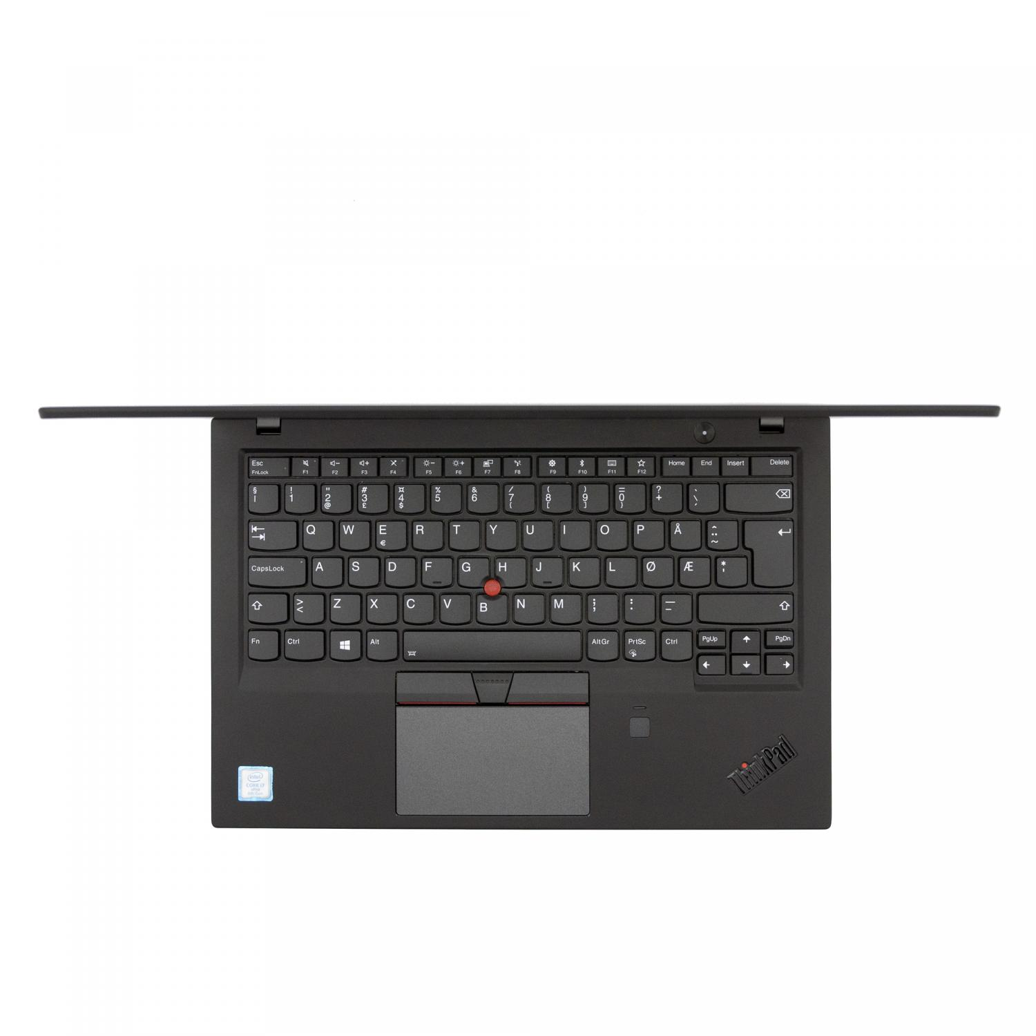 Ein schwarzer Laptop mit rotem Trackpoint in der Mitte der Tastatur. Der Bildschirm ist geschlossen.