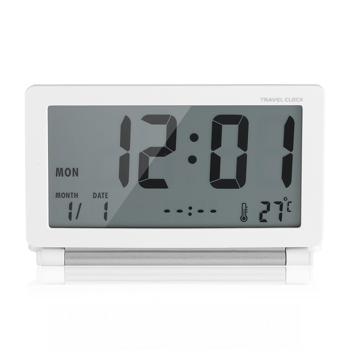 Eine weiße digitale Reiseuhr mit der Uhrzeit 12:01, Datum und Temperatur.