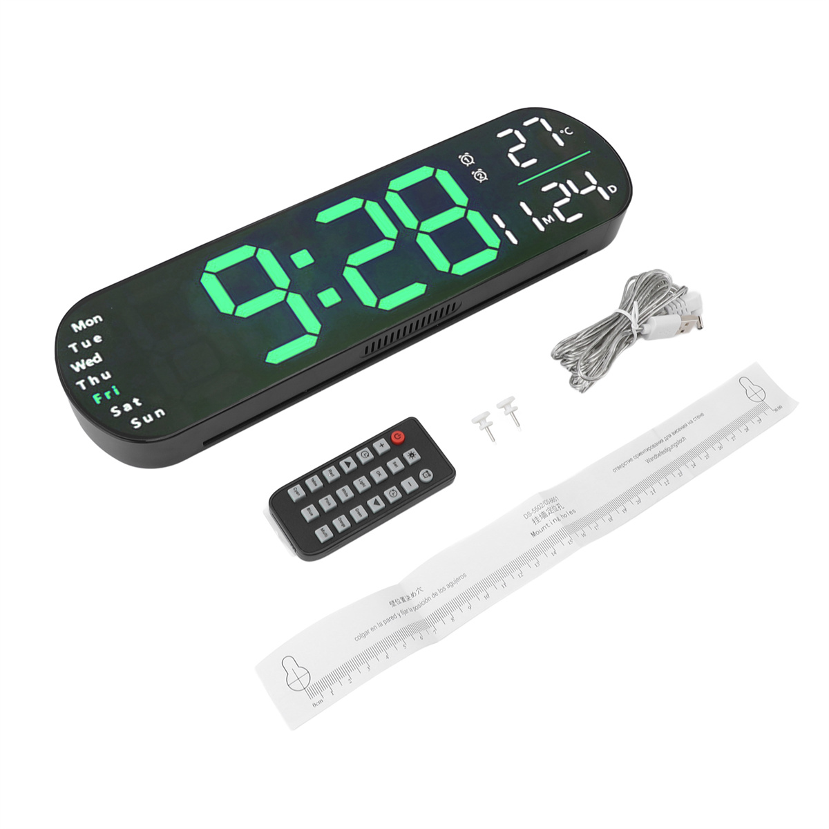 Digitaluhr mit Fernbedienung, Batterien und einem Lineal.