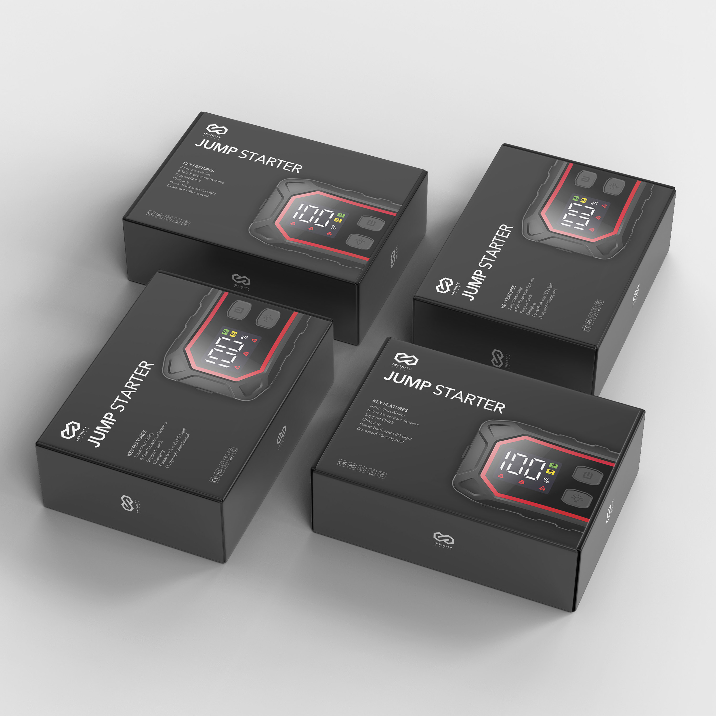 Vier zwarte dozen met het label 'JUMP STARTER', met een rood en zwart elektronisch display.