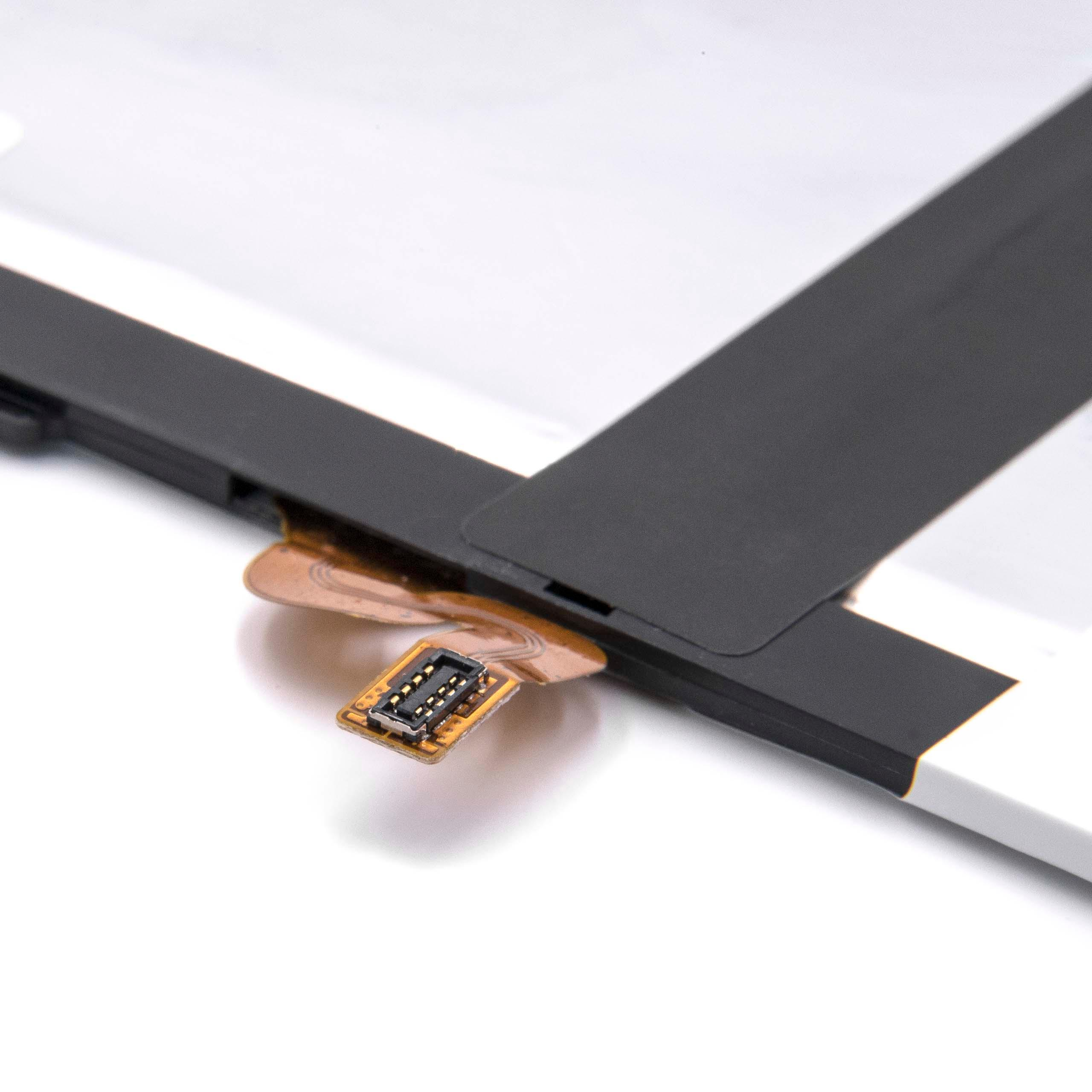 Eine kleine elektronische Komponente, die an einem flexiblen Band befestigt ist, mit weißem Hintergrund.