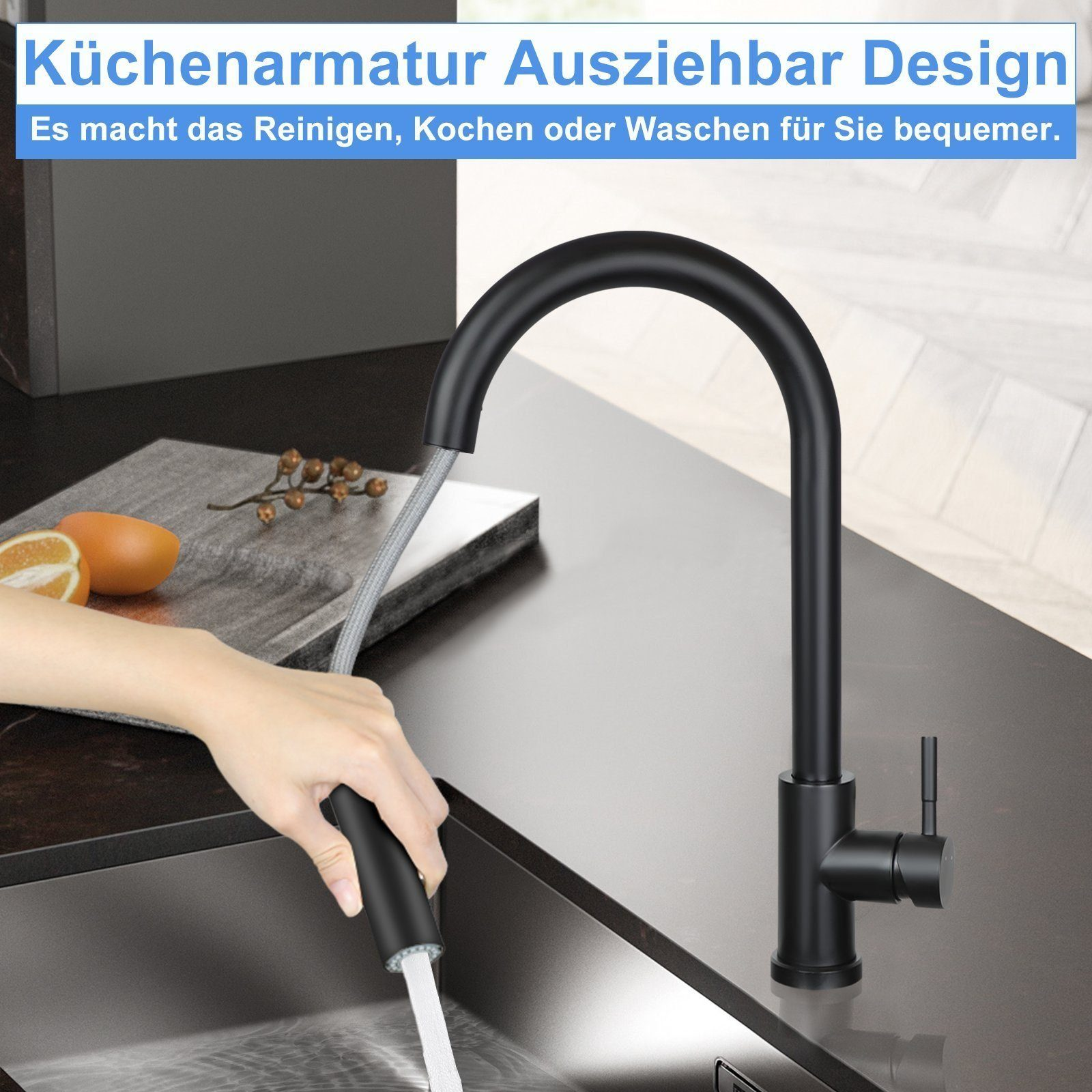 Schwarze Küchenarmatur mit ausziehbarem Sprüher, auf dunkler Arbeitsplatte mit einer Orangenscheibe sichtbar.