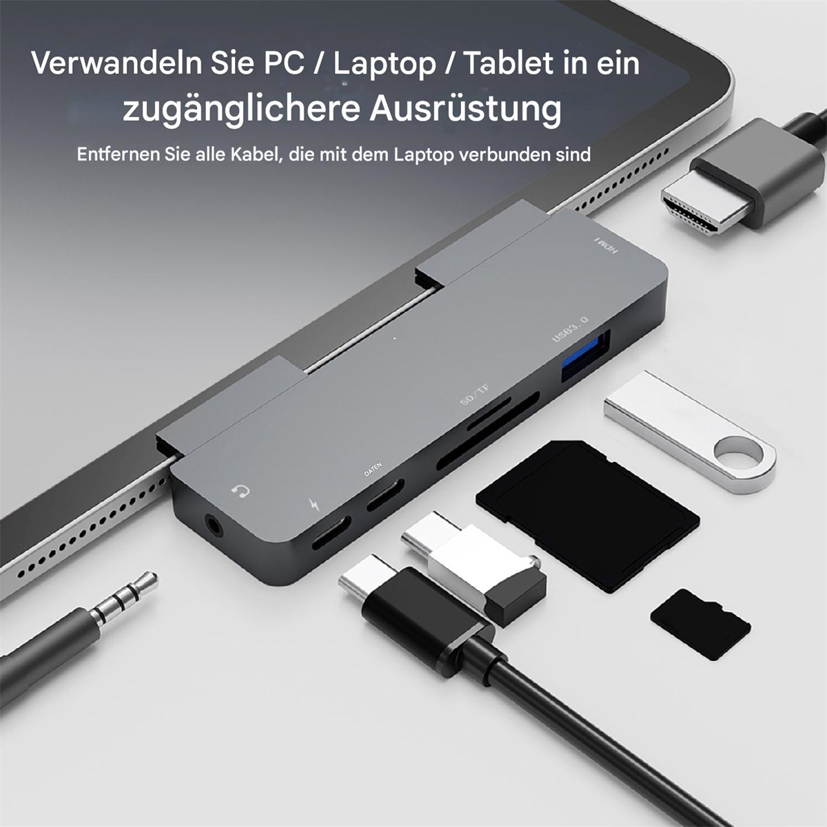 Ein Tablet mit einem grauen Hub mit mehreren Anschlüssen und angeschlossenem Zubehör.