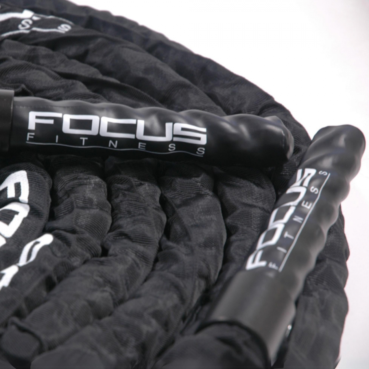Black battle ropes with black handles and white text, on a white surface.