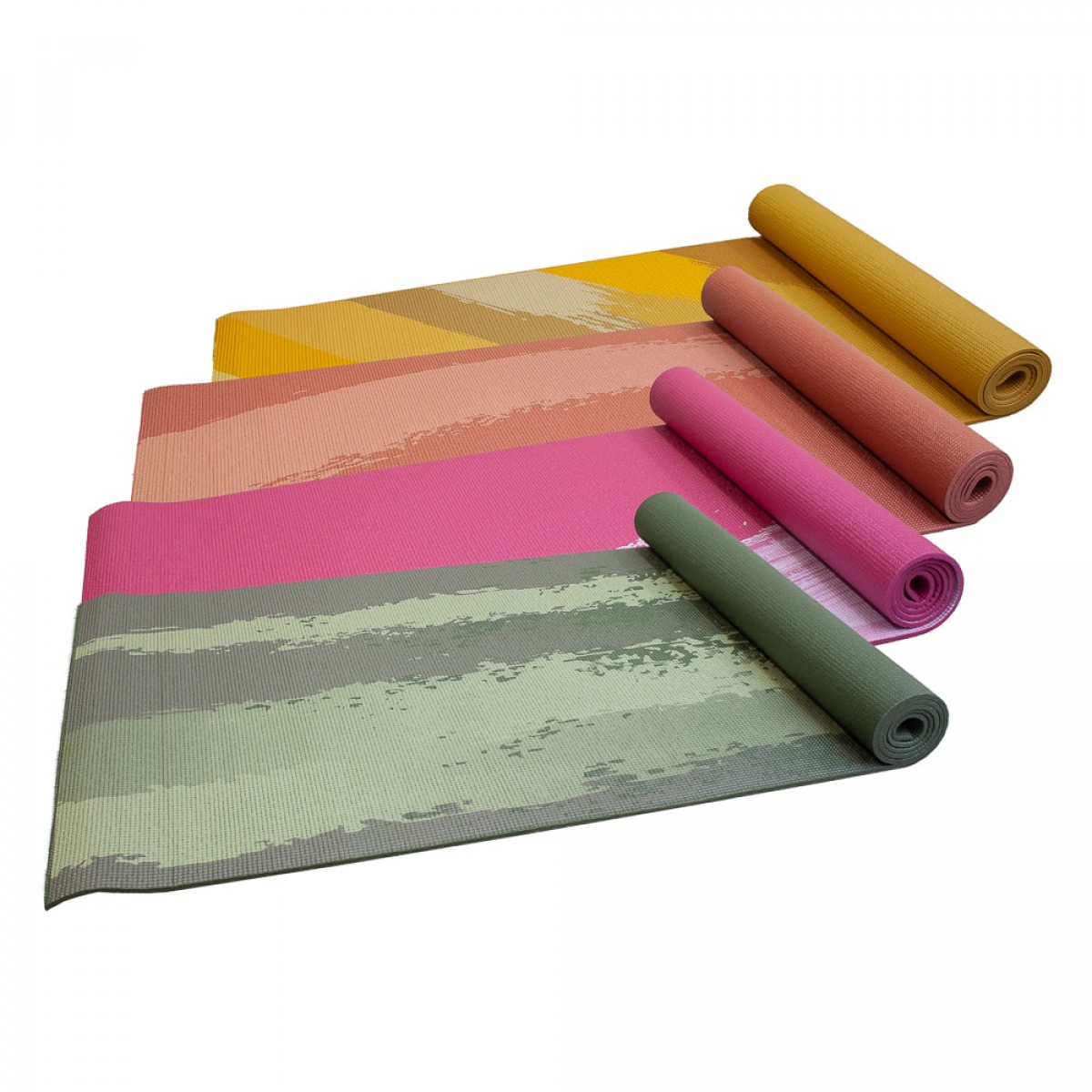 Yoga mats rolled up in different colors. Yellow, pink, and green.
