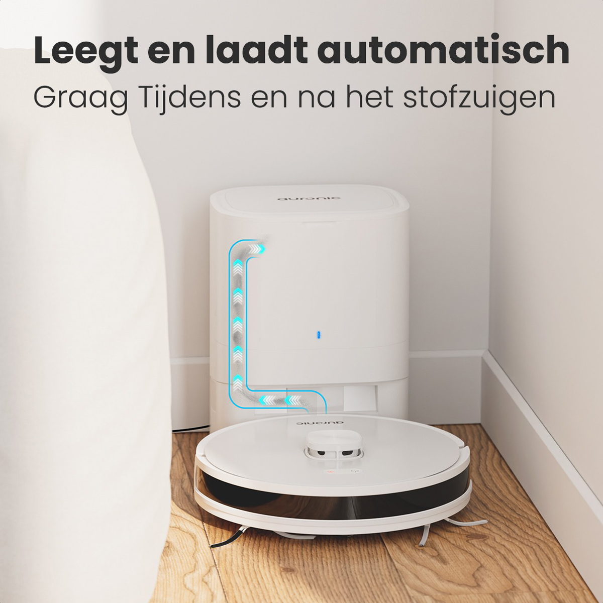 Aspirateur robot blanc près de la station de charge, avec lignes de charge bleues.