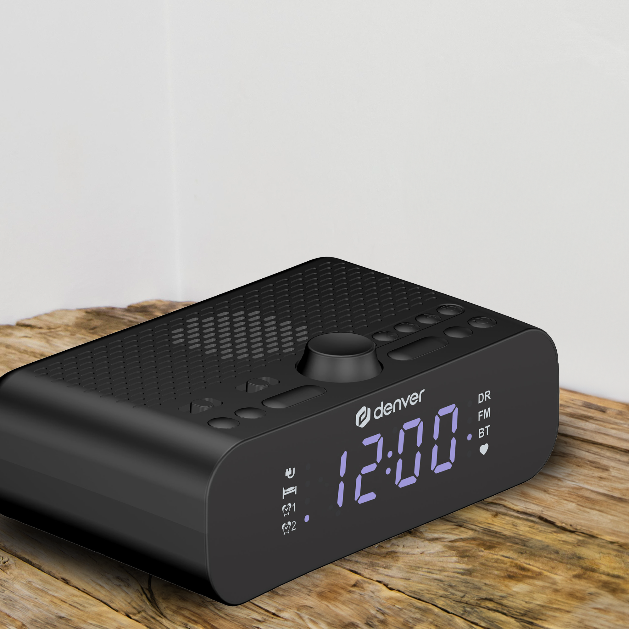 Schwarze Denver Digitaluhr auf einem Holztisch, Anzeige 12:00.