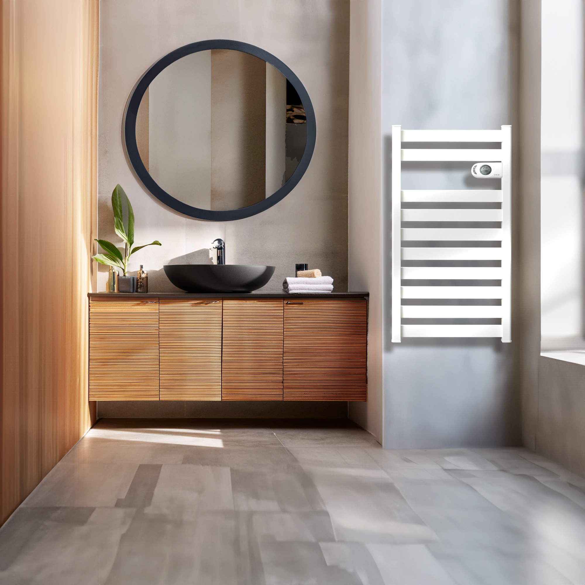 Baño con mueble de madera, espejo y toallero blanco en la pared.