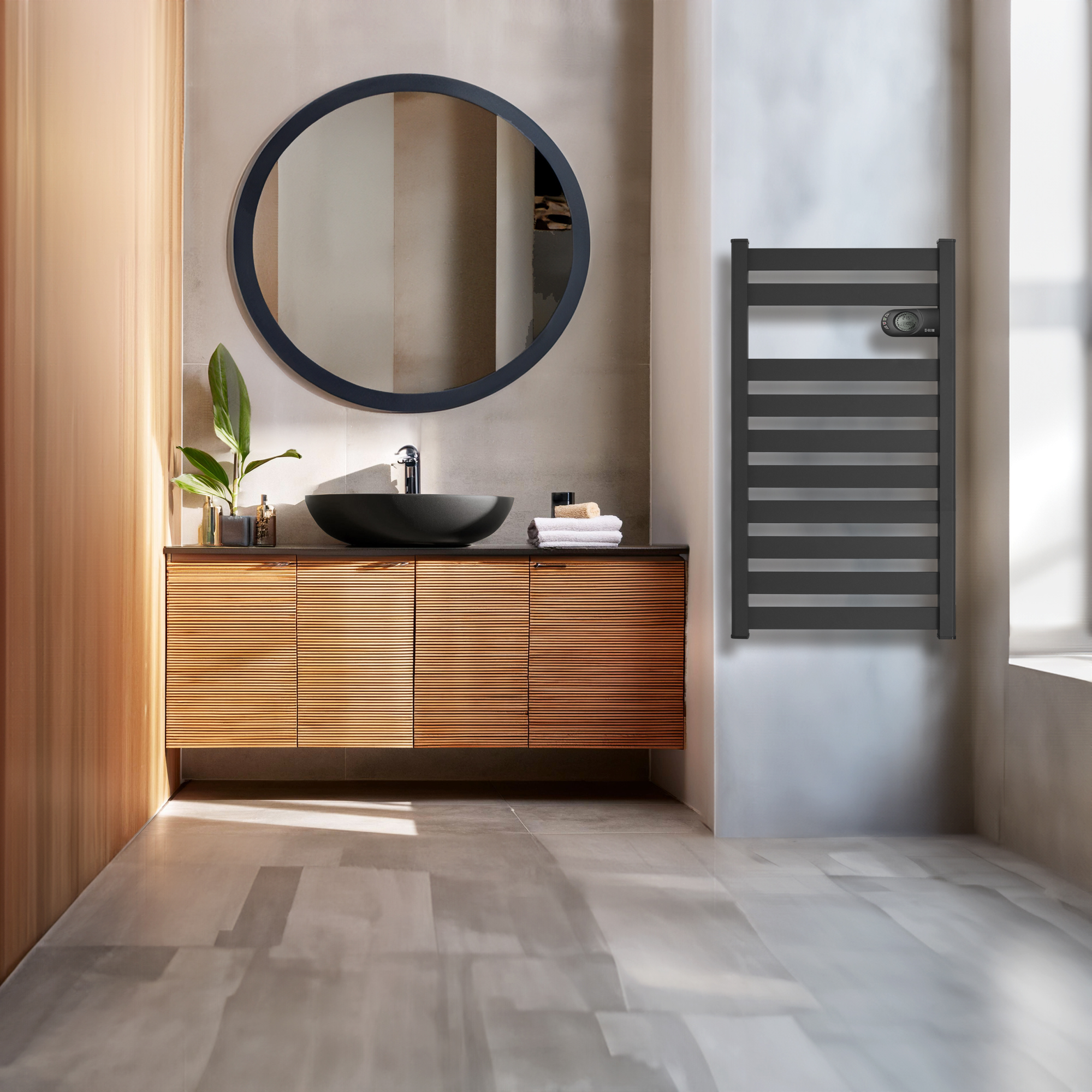 Baño moderno con mueble de madera, lavabo negro y radiador negro.