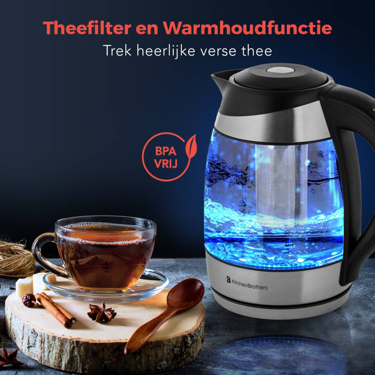 A glass electric kettle with tea, cinnamon, and a wooden spoon.