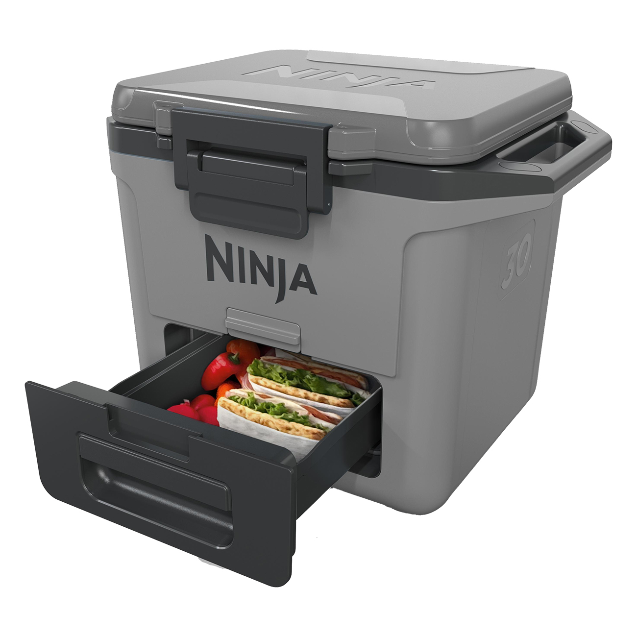 Szara lodówka Ninja z otwartą szufladą, z kanapkami i czerwoną papryką. Na białym tle.