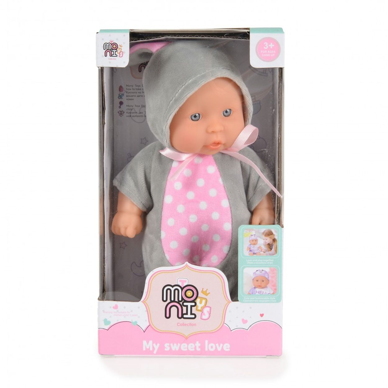 Puppe in grauem Hasenanzug mit rosa Schleife, in einer Box.