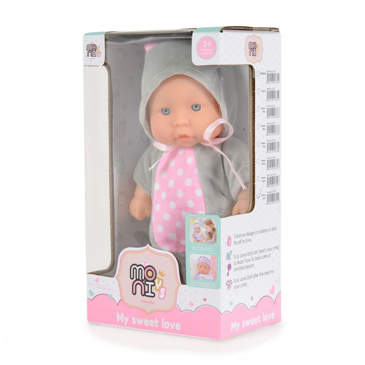 Babypuppe in einer Box. Die Puppe trägt ein grau-rosa Outfit mit Hut.