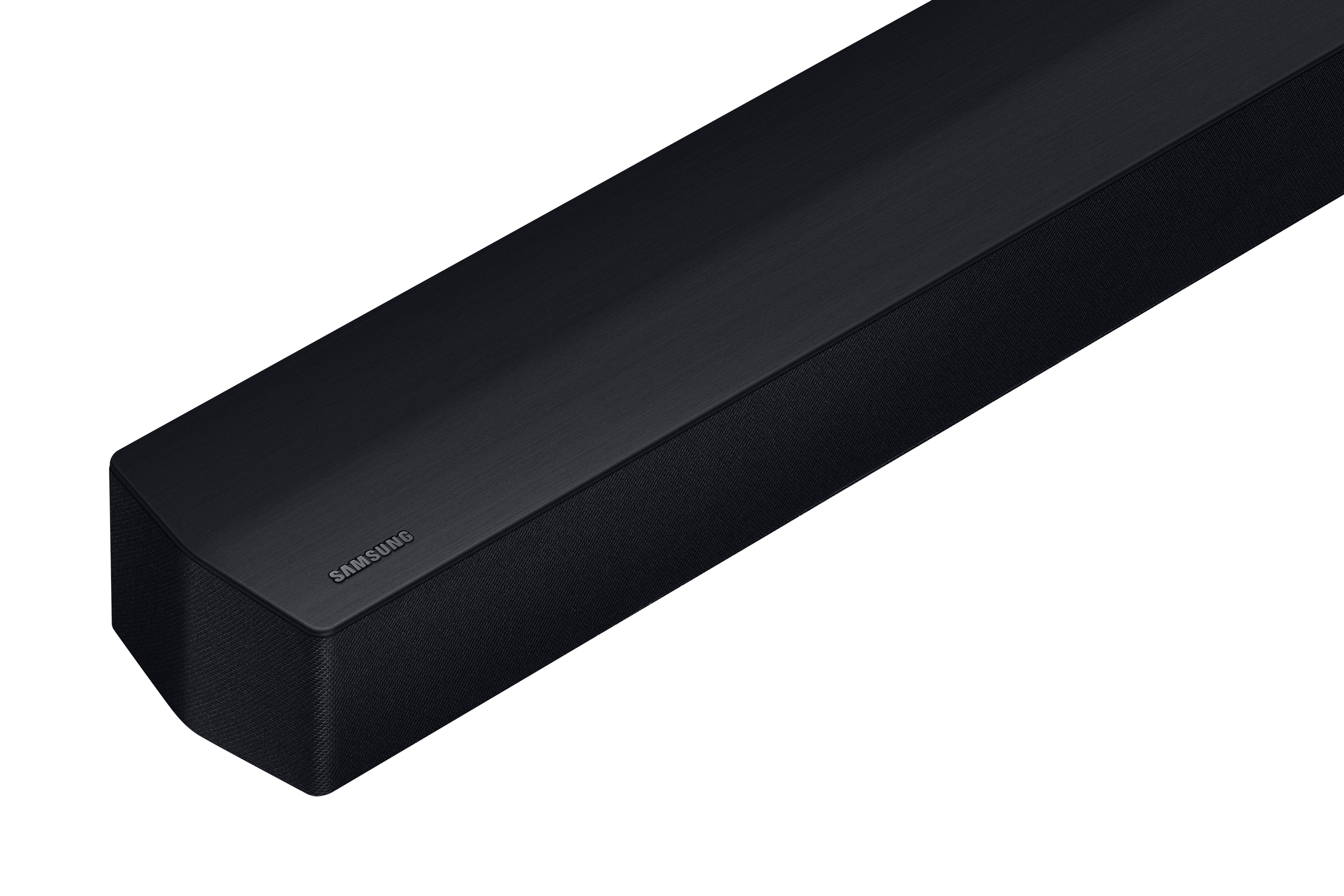 Soundbar Samsung nera su bianco. Presenta il logo Samsung e una superficie strutturata.