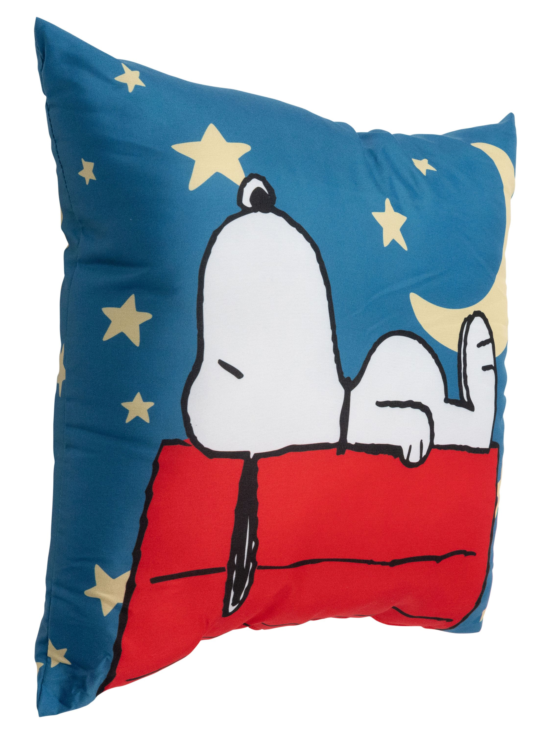 Ein Kissen mit Snoopy auf einem roten Hundehütte, blauer Sternenhimmel Hintergrund.